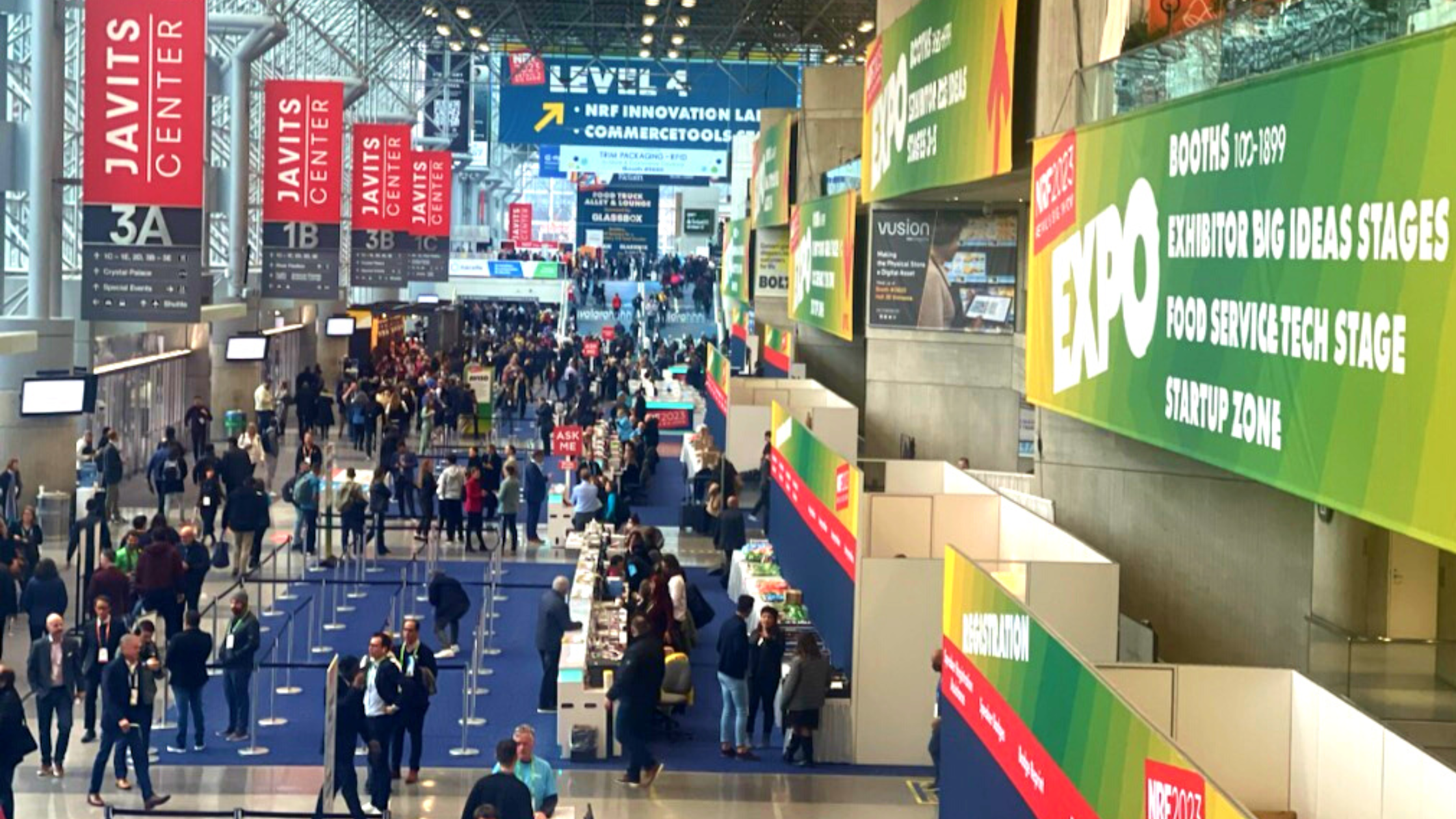 A crowd of people on the 2023 NRF Big Show expo floor.